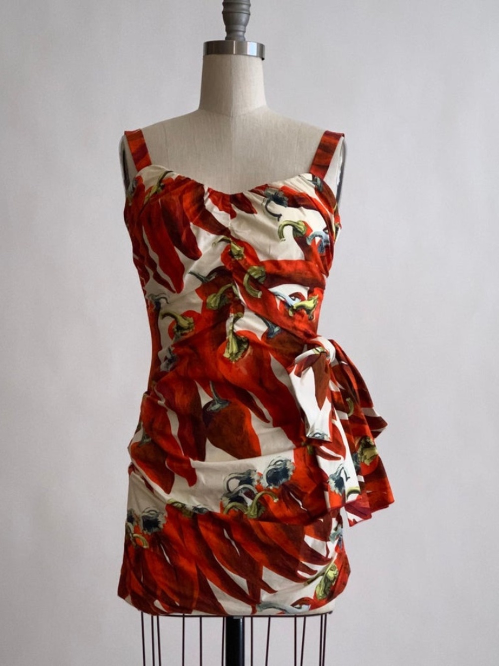 Red chili pepper print ruched mini dress featuring a side bow accent - Picture 2 of 10